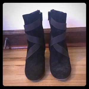 Black UGG boots with a heel